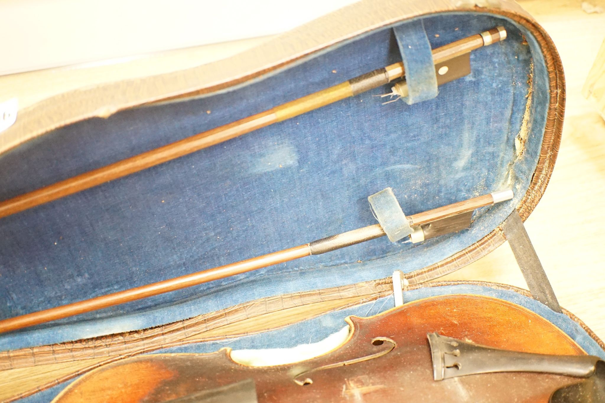 A late 19th century German violin and two bows, cased